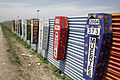 Border at Tijuana, Mexico and San Ysidro, California, United States with memorial coffins for those killed crossing this border. A straight-line border surveyed when the region was thinly populated.