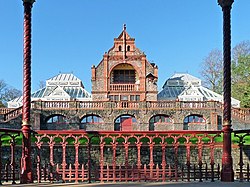 A photograph showing the 19th century Pavilion and Conservatories, surrounded by the green spaces of the Park