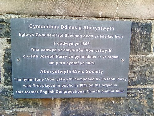 Plaque to commemorate the 1st performance of the hymn tune "Aberystwyth" on Aberystwyth town's former English Congregational church, now a medical surgery