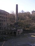 Former boiler house and attached chimney to north of Old Lane Mill