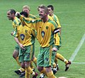 Picture of footballer Iwan Roberts, with a number of other players visible in the background