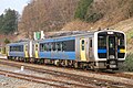 A two-car KiHa E200 series train on the Koumi Line, April 2009