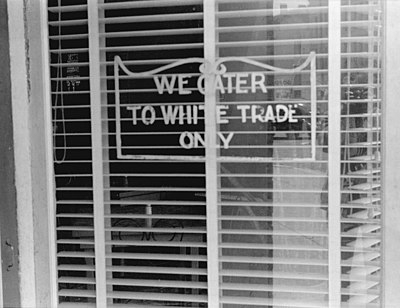 Sign reading "We cater to White Trade only"