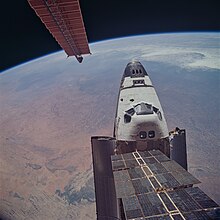 Atlantis docked to the Mir space station, over Saharan Africa STS081-748-019.jpg