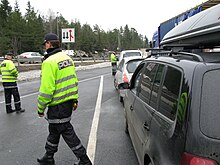 The National Mobile Police Service performing a traffic control on E18 Fartskontroll.jpg