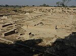 Archaeological site with some brick walls visible