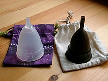 Two menstrual cups with breathable cotton storage bags, one undyed. Diva Cup and the Keeper.jpg