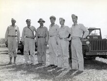 Left to Right: Unidentified, Major General Franklin Sibert Jr., Colonel Lyle H. Meyer (MAG-24 CO), Lt. General Robert L. Eichelberger, Lt. Col Keith B. McCutcheon (MAG-24), Lt. Col John H. Earle, Jr. (XO MAG-24). 127-GC-1442-119915.tif