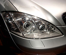 Night View Assist infrared projector visible next to Bi-Xenon HID main headlight, Mercedes-Benz S-Class (W221) IAA-2005-S-Class Light.jpg