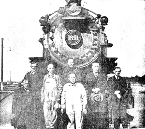 front of locomotive with crew