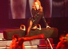 Minogue performing "Red Blooded Woman" during her 2009 North American For You, For Me tour P1030298 (4020171085) (cropped).jpg