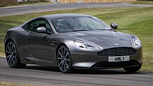 A dark grey DB9 GT on a racing track