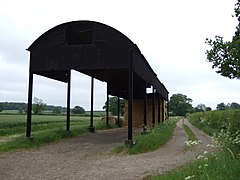 No walls are a characteristic of what in the United Kingdom is called a Dutch barn.