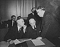 Image 50John L. Lewis (right, President of the United Mine Workers, confers with Thomas Kennedy (left), UMW Secretary-Treasurer of the UMW, and a UMW official at the War Labor Board in 1943 about a coal miners' strike.