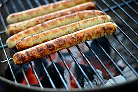 Some sausages grilling