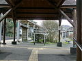 Entrance to the platforms from the station building. Note the platforms to the left and right of the wide, landscaped triangle.