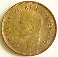 VI. György király dél-afrikai farthing (1/4 penny) érméjének előoldala az uralkodó képmásával.