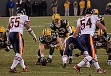 Packers and Bears players lining up before the snap of the football to quarterback Aaron Rodgers