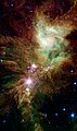 "Christmas Tree Cluster" newly formed stars as taken by NASA's Spitzer Space Telescope.