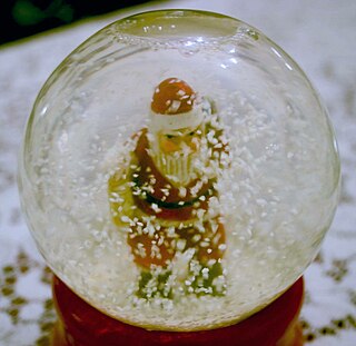 <span class="mw-page-title-main">Snow globe</span> Decorative water filled small glass sphere enclosing a miniaturized scene