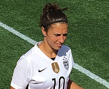 Carli Lloyd wears the FIFA Champions Badge on her United States women's national soccer team kit; the U.S. women's team has held the award from 5 July 2015-20 August 2023, a national team record. Carli Lloyd.jpg