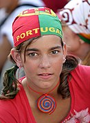 Girl wearing a bandana on her head to support Portugal in soccer, in the colors of that country's flag