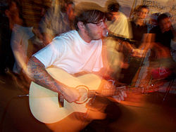 Green performing at Edge102.1 Radio Studios in July 2005 DallasGreenEdge2005.JPG