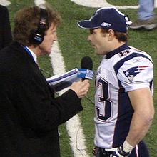 Welker (right) being interviewed after the final game of the undefeated 2007 Patriots regular season Patriotsgiants 046.jpg