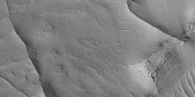 Close view of ridges, as seen by HiRISE under HiWish program. This is an enlargement of a previous image. A small mesa in the image displays layers.