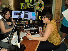 KRBX Radio Boise volunteers during the station's Spring Radiothon in 2013--direct community support is critical for such local media. TennisCourtDiscoKRBXRadioBoiseVolunteers.JPG