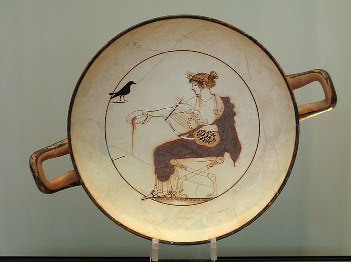 Attic white ground Kylix featuring Apollo with a black bird. Probably painted by the Pistoxenos Painter.