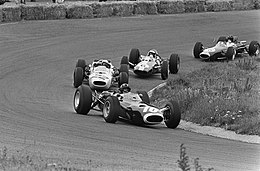 Graham Hill in his BRM P261, leading in the early laps of the 1965 Dutch Grand Prix. He had started in pole position, but finished the race in fourth. G. Hill, Ginther, Clark and Gurney at 1965 Dutch Grand Prix.jpg