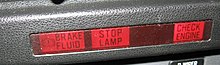 A group of tell-tales showing lights for "brake fluid", "stop lamp" and "check engine" Idiot lights.jpg