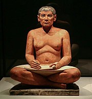 The so-called Seated Scribe. Painted limestone, eyes inlaid with rock crystal in copper, 4th of 5th dynasty of Egypt, 2600–2350 BC. From Saqqarah.