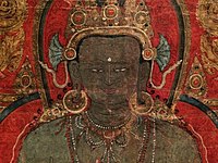 Close up view of Amoghasiddhi from a Tibetan painting, 1300–1400 CE