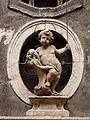 Statue of Simon of Trent on the facade of a palace in Trento (situated in "Via del Simonino")