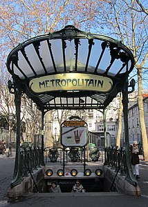 Paris metro station entrance at Abbesses designed by Hector Guimard for the exposition