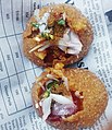 A Bangladeshi fuchka type bhelpuri served on bengali newspaper