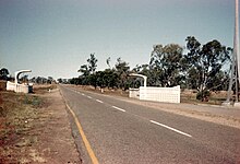 Tropic of Capricorn monuments in Rockhampton, c. 1970) Road-to-Rockhampton.jpg