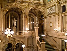 A marble staircase between the main entrance and the first floor