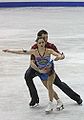 Pairs skaters Marissa Castelli and Simon Shnapir set up for a throw jump.