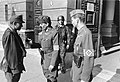 Image 45Ernö Gömbös, (r.) aide-de-camp to Ferenc Szálasi and Gyula Gömbös's son, along with a Honved officer and a member of the Arrow Cross Party, in front of the Ministry of Defense, 1944. (from History of Hungary)