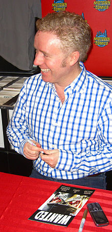 Writer Mark Millar signing a copy of the book during an appearance at Midtown Comics in Manhattan. 4.25.13MarkMillarByLuigiNovi42.jpg