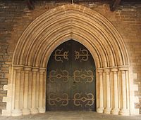 Buff-coloured basalt and limestone doorway to the CNI Afghan Church.[175]