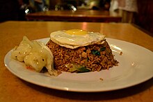 Sri Lankan nasi goreng served with a fried egg Nasigroni Rice.JPG