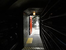 Tunnel passant sous la barrière