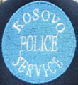 First cap badge of the Kosovo Police Service[20]