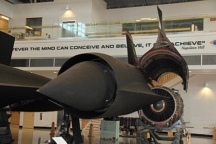 Fig.4 A view showing the entry to the inlet. Behind is the outer wing and hinged portion of the nacelle which encloses the engine. The spike is shown in the forward position (for speeds below M1.6). Just discernible behind the cowl lip are spike boundary layer bleed slots where the normal shock is located at higher speeds when the spike has moved rearwards, the cowl bleed 'shock trap' ram intake, streamlined bodies ('mice') and, between the mice, the forward bypass door openings[76] which dump unwanted air externally through the front louvers and cause significant nacelle drag.[77] When the landing gear is down, ambient air flows in reverse through the bypass to supplement the front inlet flow into the engine.