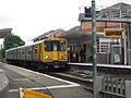 A Merseyrail Class 507 unit waits with a service to Liverpool.