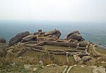 Ancient ruins, walls, and great boulders on the slope of a hill